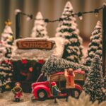 pine cone on top of red vehicle Christmas table decor